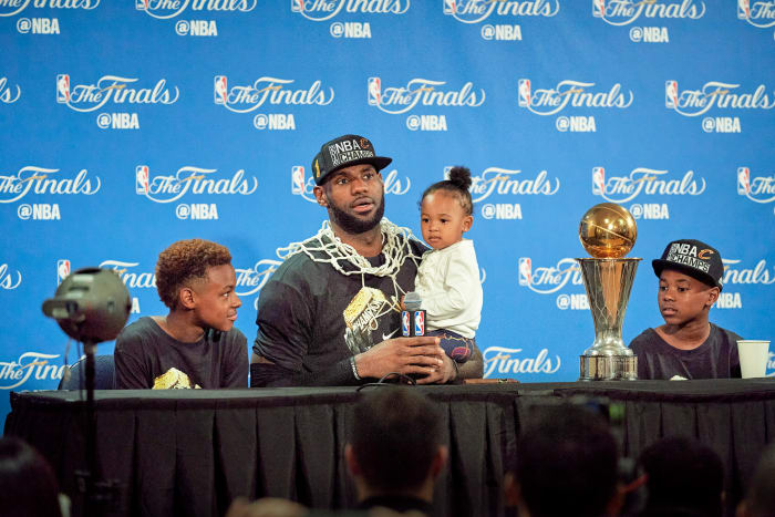 By the time James won a title with the Cavs, in 2016, ESPN had already reported that Duke had offered Bronny (left, with Zhuri and Bryce) a scholarship.